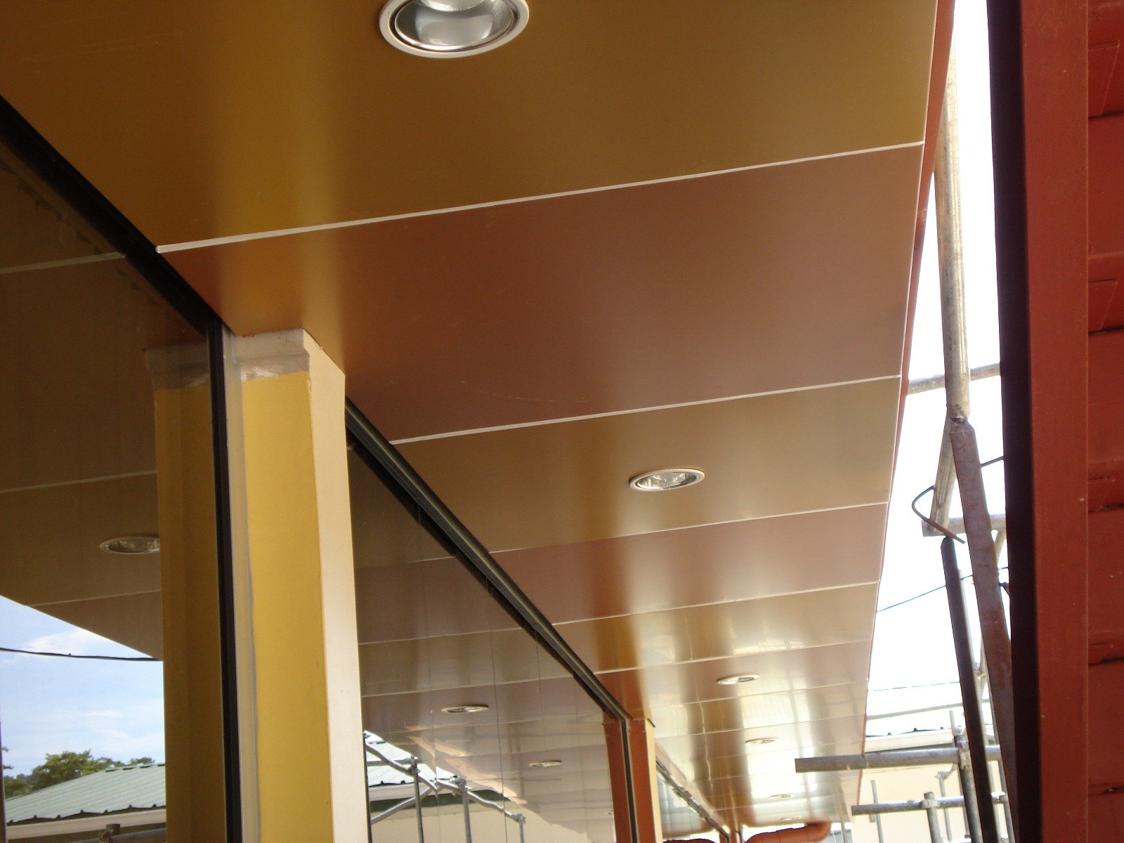 Composite panel soffit and ceiling installation